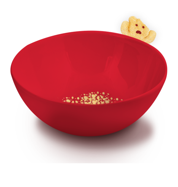 An empty red bowl with some crumbs and a bitten POM-BÄR